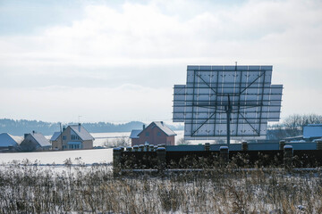 Solar panel in winter. Rearview. Countryside. Copy space.