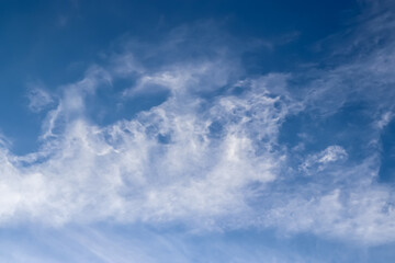 Stunning cirrus cloud formation panorama in a deep blue sky