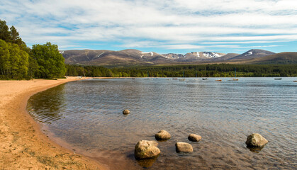 A calm Loch Morlich near Aviemore on a gentle summers day 