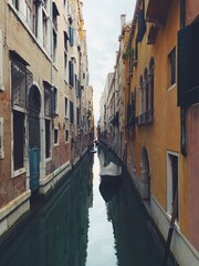 Fototapeta na wymiar Venice canal breathtaking view at the really small space with gondolas