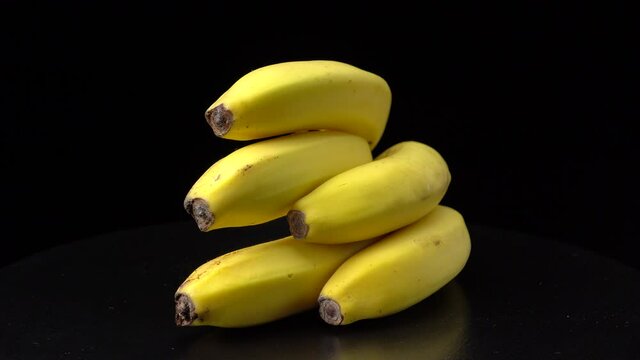Bananas on a black background close-up.