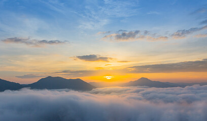Obraz premium The beautiful view of the sunrise against the sea of mist at Phu Tok, Loei, Thailand.