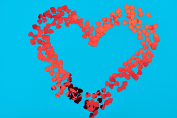 Many little hearts make a frame with place for text for valentine's day. Blue color love background. High quality photo