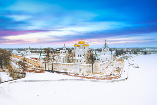 Aerial drone view of the Orthodox Holy Trinity Ipatievsky monastery during winter sunset in Kostroma, Russia. Ancient touristic city of the Golden Ring.