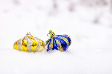 Bright blue and gold vintage Christmas toys on the snow. Close-up. Christmas and New Year