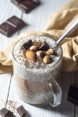 Chia pudding with cocoa, chocolate and nuts in almond milk