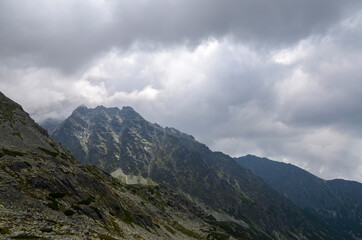 Amazing landscape with cloudy sky over majestic high rocky mountains in High Tatras, Slovakia