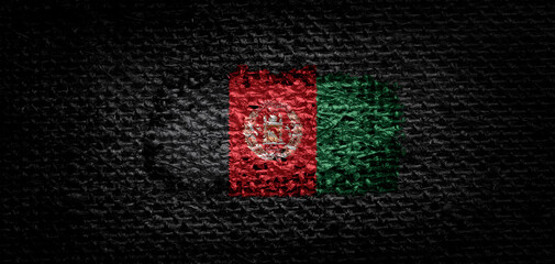 National flag of the Afghanistan on dark fabric