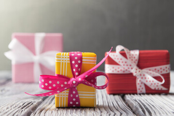 Gift boxes over blur grey background with copy space