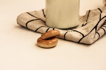 Two tasty bagels and milk on white background. Side view