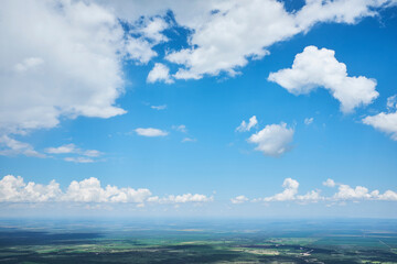 Naklejka na ściany i meble White clouds on blue sky from the mountain. Summer Sky.
