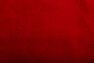Texture of red fleece straight fabric, background or backdrop. Clothing, sewing, gressmaking, haberdashery. Copy space.