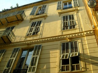 Obraz premium French style windows and shutters in an old house in Cannes, France.