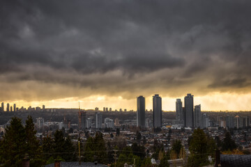 Fototapeta na wymiar Burnaby, Vancouver, British Columbia, Canada. Beautiful Aerial View of a modern city during a stormy and rainy day. Cityscape Buildings. Dramatic Art Render