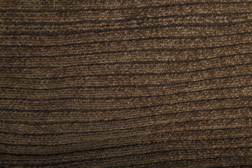 Knit green-grey fabric texture, background or backdrop. Textile, scarf or sweater textured surface. Warm accessories, clothing, fashion concept.