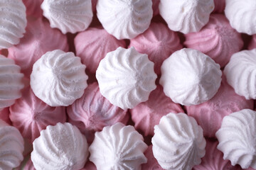 White and pink meringue cookies. Macro. Top view.