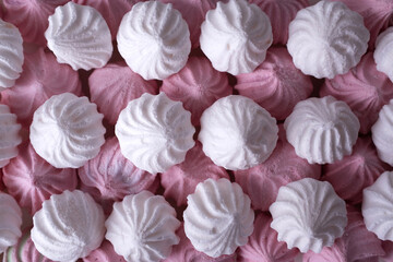 White and pink meringue cookies. Macro. Top view.