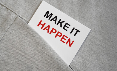 MAKE IT HAPPEN motivational quote on a white sticker in a pocket. Inspiration.