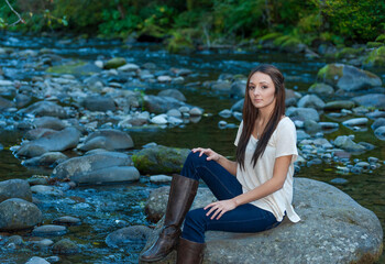 Young Woman Poses Along the Banks of a River