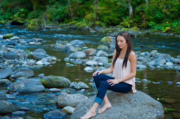Young Woman Poses Along the Banks of a River