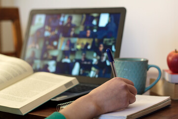 Young woman taking an online class at home