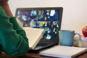 Young woman taking an online class at home