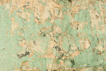 Destroyed Peeling Faded Paint Texture Background. Old Urban Cracked Painted Green Surface. Distressed Plaster Wall Rough Backdrop.