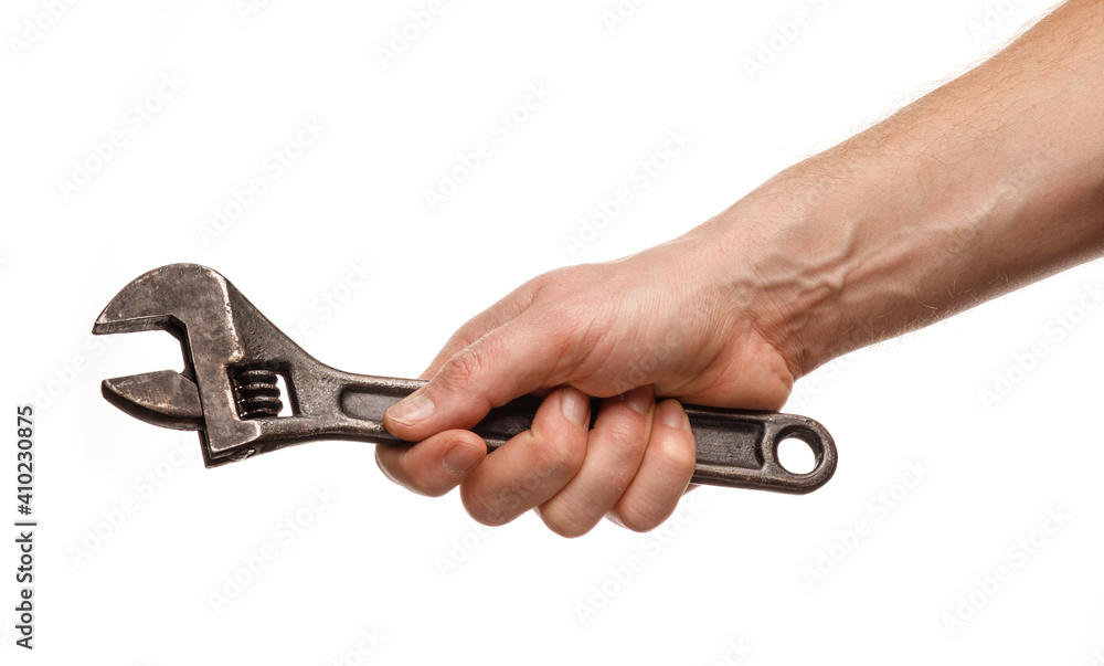 Poster adjustable wrench in the hands of a man on a white background isolate and close-up