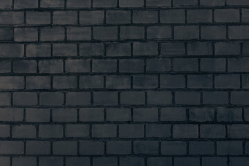 Dark grey brick wall. Abstract decorative grey background or art texture.