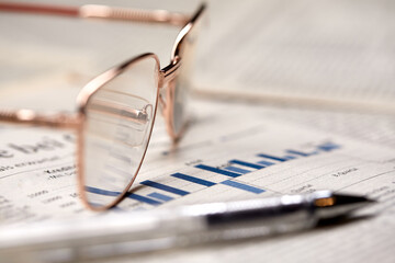 eyeglasses on the newspaper pages