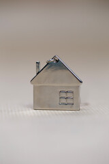 Obraz na płótnie Canvas Little miniature house on blurred background, New home, Real Estate, Mortgage loan,architectural concept with Copy space