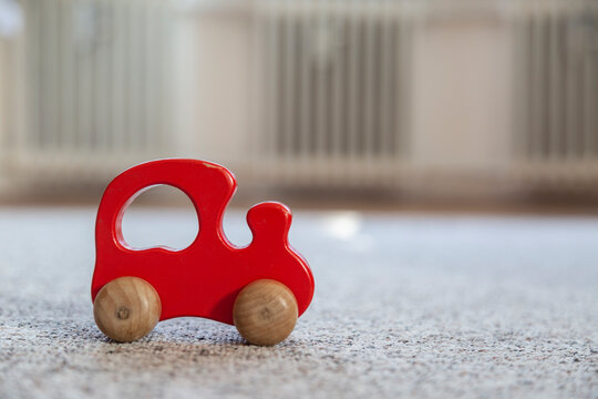 Single red wooden toy car