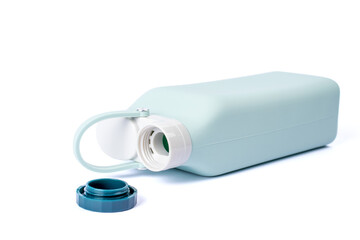 Silicone water bottle isolated on white background. Collapsible Eco friendly bottle. Photography for design.