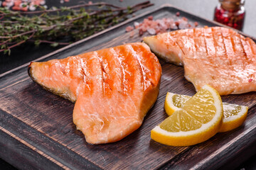 Tasty fresh red fish arctic char baked on a grill