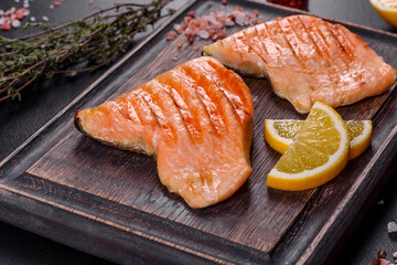 Tasty fresh red fish arctic char baked on a grill