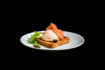 Salmon spread with capers on cracker