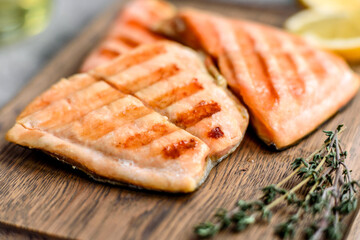 Tasty fresh red fish arctic char baked on a grill