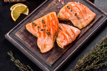 Tasty fresh red fish arctic char baked on a grill