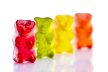 Sweet gummy bears on white background