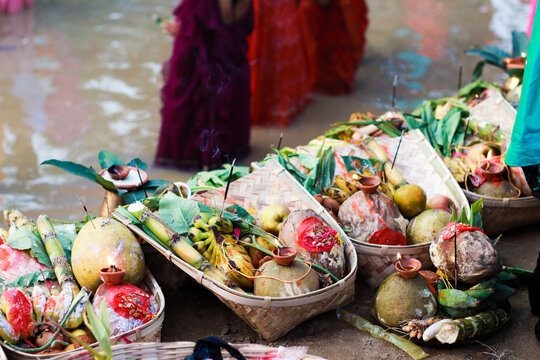 holy offerings of fruits flowers lamps and cloths in river to sun god on the occasion of chhath puja or chatt puja