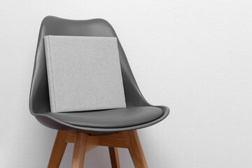 amily photo book.
stylish Photo album on chair .
grey photobook with  leather cover.
Beautiful...