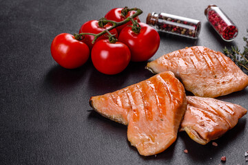 Tasty fresh red fish arctic char baked on a grill