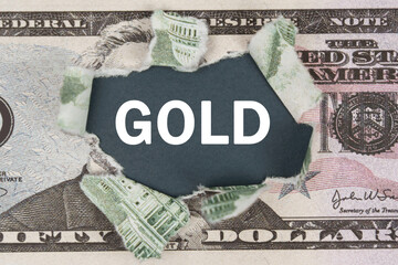 The dollar is torn in the center. In the center it is written - GOLD
