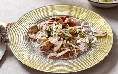Champignons with meat and onions, sun-dried tomatoes. Delicious and unusual salad.