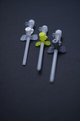 intravenous catheters on a black background, shot close-up. multicolored catheters have different diameters - from the smallest to the largest