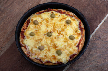 Home made cheese italian Pizza with tomate sauce and black background