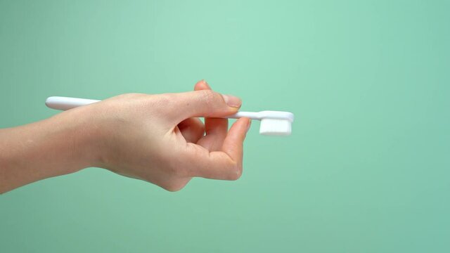 Testing a new toothbrush. Feel the new ultra soft toothbrush bristles with your finger