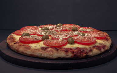 Home made Napolitana italian Pizza with cheese and tomate sauce. 