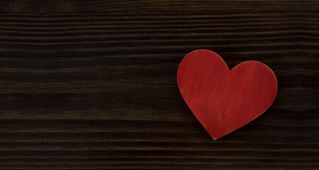 Red heart on a wooden background. St. Valentine's Day. Love