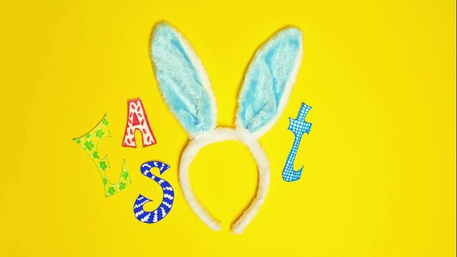 Yellow background with title Easter and Bunny's hears for Easter.